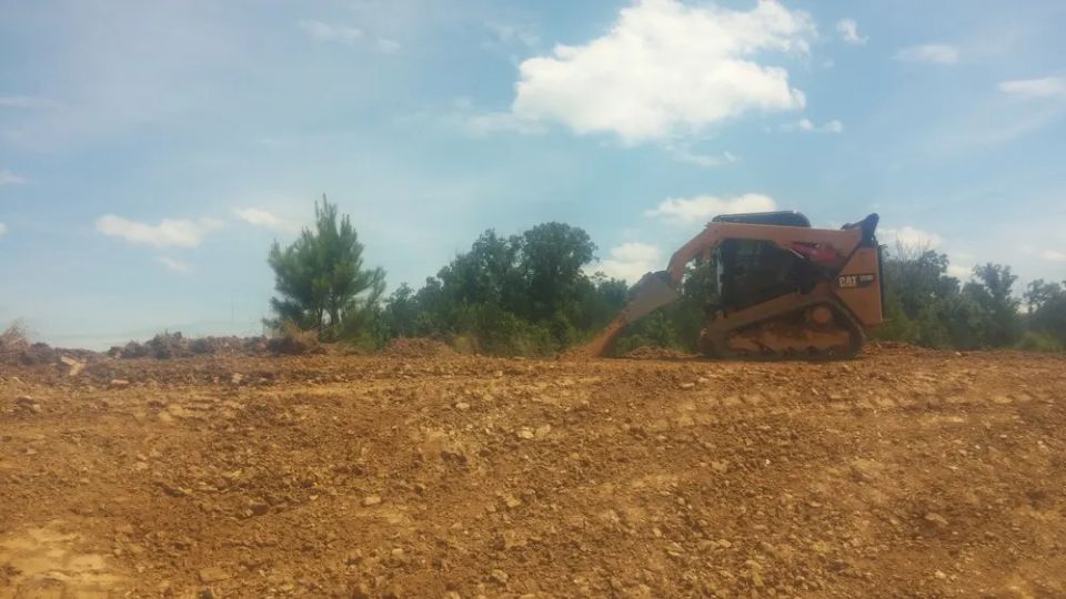 Grading around a newly constructed house — photo 10