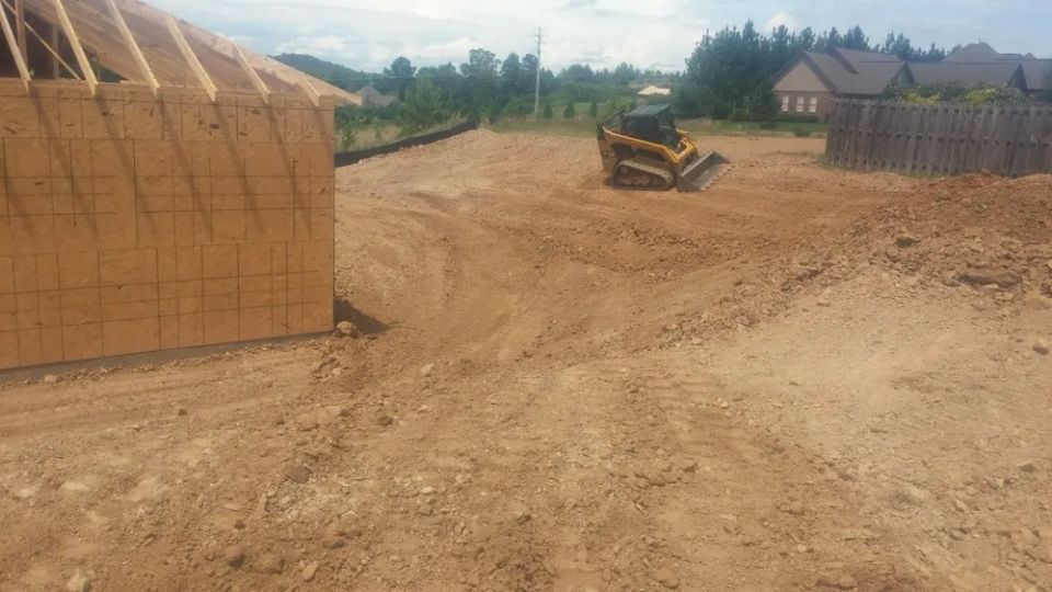 Grading around a newly constructed house — photo 3