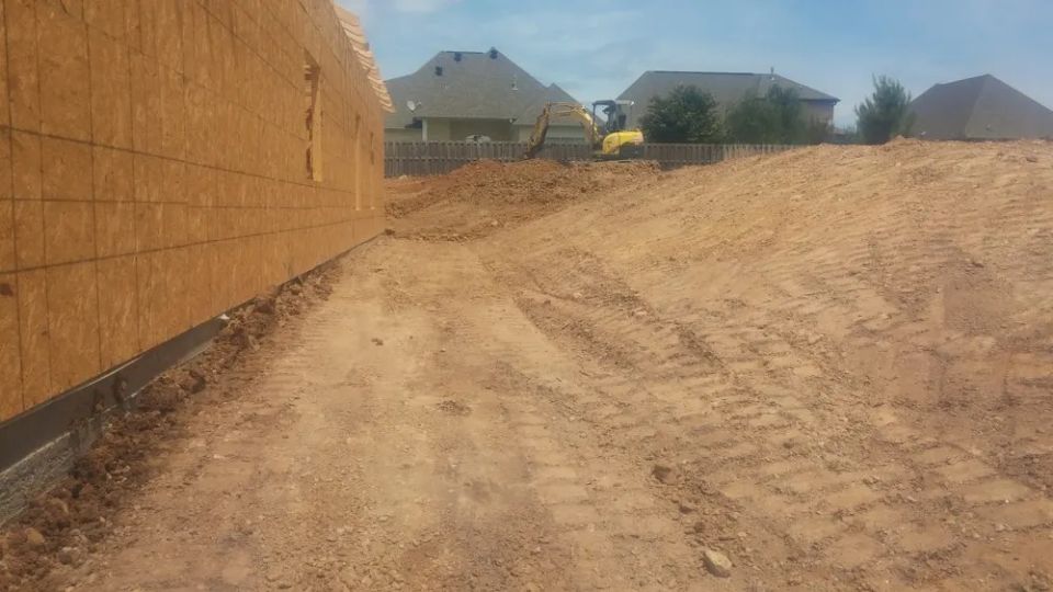 Grading around a newly constructed house — photo 4