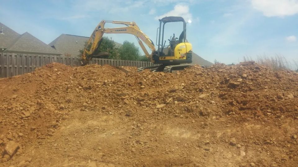 Grading around a newly constructed house — photo 6