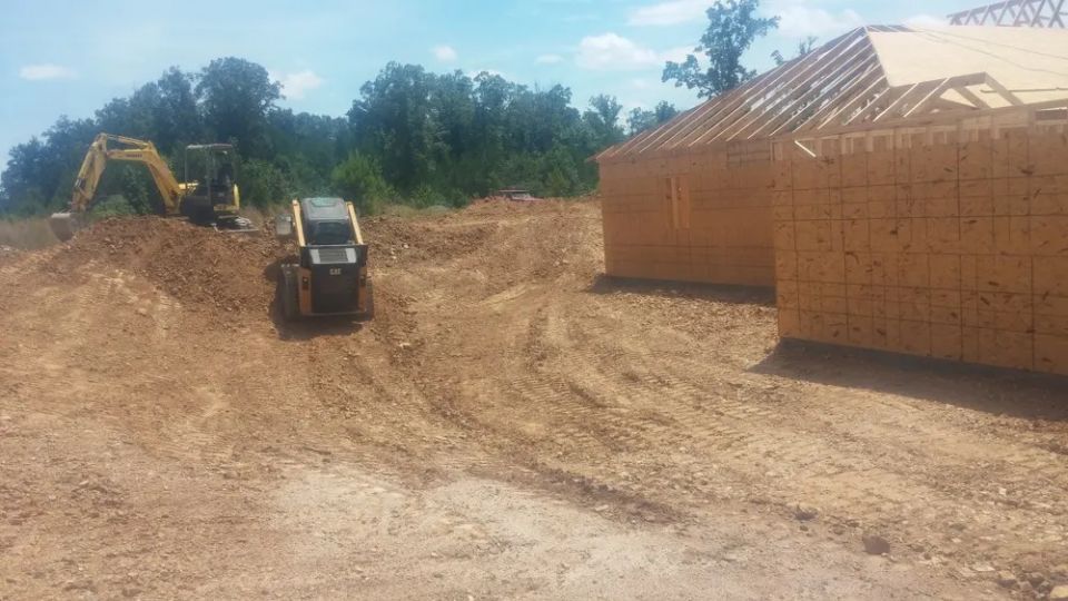 Grading around a newly constructed house — photo 8