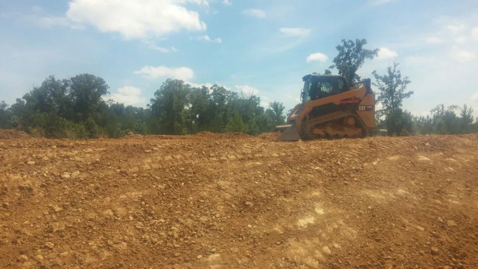 Grading around a newly constructed house — photo 9